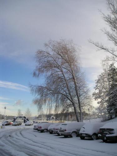 Snow in Finland - What causes winter   Illumination of Earth by Sun in the northern hemisphere winterThe tilt of the earth's axis relative to its orbital plane has a dramatic effect on the weather. The popular belief that winter is caused by the Earth being farther from the Sun than in summer is not true. In fact, in the Northern Hemisphere, winter occurs when the Earth is its closest to the Sun.  The earth is tilted at an angle of 23°27' (23 degrees 27 minutes) to the plane of its orbit, and this causes different latitudes on the Earth to directly face the Sun as the Earth moves through its orbit. It is this variation that primarily brings about the seasons. When it is winter in the Northern Hemisphere, the Southern Hemisphere faces the Sun more directly and thus experiences warmer temperatures than the Northern Hemisphere.  During winter in either hemisphere, sunlight hits that hemisphere at an oblique angle. In regions experiencing winter, the same amount of solar radiation is spread out over a larger area (see Effect of sun angle on climate). This effect is compounded by the larger distance that the light must travel through the atmosphere, allowing the atmosphere to filter more of this already limited heat.