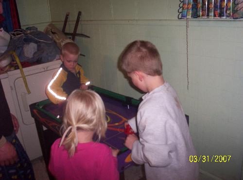 Kids playing on game table with their stepdad - Kids playing on their 8-in-1 game table with their step dad. Having fun!