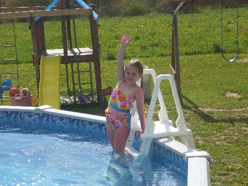 My daughter going swimming - Katelyn getting in the pool.