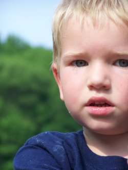 Cade - I love taking pictures of my kiddo's playing outside. The random non posed pictures seem to show their true colors. He was playing with a car jack.
