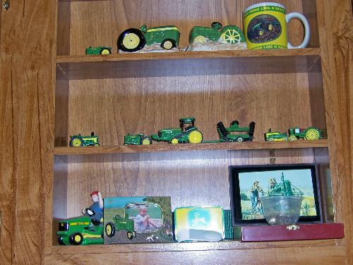 John Deere Kitchen Shadow Box - This is a photo of the shadow box in my kitchen which is decorated with John Deere as the theme...ooopppsss I forgot to take the little plastic cup down that I keep my jewerly in when washing dishes....oh,well, you get the general idea....