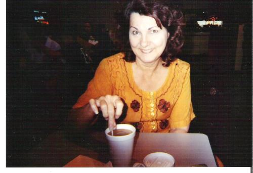 Picture of Me - me in yellow dress dunking a cookie in coffee