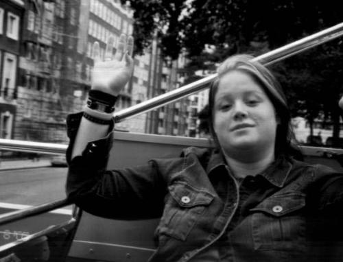 Bus Tours - This is me on a double decker bus in London England. I was doing a bus tour and it was windy out. I was attempting to grab the leaves off of the tree's.