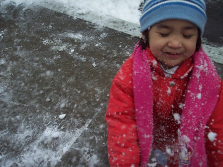Snow'd! - One of those charming little moments that gets captured. My little niece playing in the snow.
