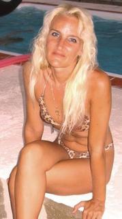 Leopard Bikini - Me by my moms pool in construction. I love to get out in the sun and tan in my bathingsuit. I love to swim and tan. I love the beach (beach bunny) Florida is great!