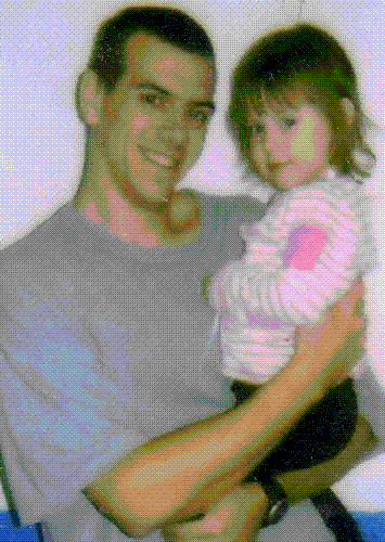 This is a picture of my friend Logan and his daugh - This is a picture of my friend Logan and his daughter Torrien. I do believe she was 3 years old at the time. She is now 5 years old.
