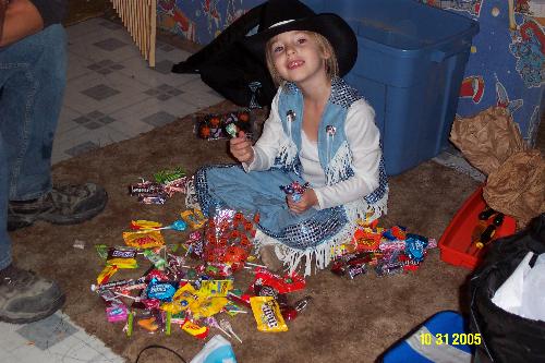 Courtney on Halloween - This is Courtney, the Cowgirl Diva, and her mad stash of candy!!