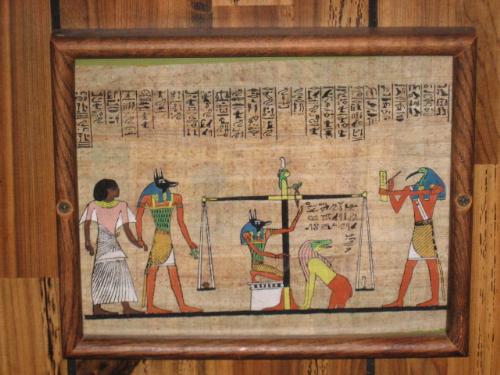 Egyptian Art - This is from Egypt. It is done on a piece of some type of cloth in a frame also. Ther's many others also. I love these art work pieces alot.