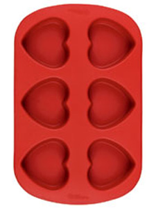 Wilton Mini Heart Silicone Mold - One cake mix makes 20 to 24 mini hearts. Freezer, refrigerator, oven, microwave and dishwasher safe. Six-cavity pan is 10 5/8 x 7 in.; individual cavities are 2 1/2 x 2 1/2 x 1 1/4 in. deep. Wilton Mini Heart Silicone Mold - One cake mix makes 20 to 24 mini hearts. Freezer, refrigerator, oven, microwave and dishwasher safe. Six-cavity pan is 10 5/8 x 7 in.; individual cavities are 2 1/2 x 2 1/2 x 1 1/4 in. deep.