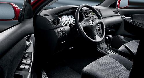 The Toyota Corolla Interior - Up to five occupants fit inside the the Corolla, which features a 60/40-split, folding rear seat. Cargo volume totals 13.6 cubic feet. Standard CE equipment includes air conditioning, power mirrors, a tilt steering column, intermittent wipers and a CD stereo. The LE adds power windows and locks, electroluminescent instrument gauges, remote keyless entry and a driver's seat height adjustment. Leather seats, previously optional on the LE, are no longer available. A unique cloth interior goes into the sporty S sedan, which features a leather-wrapped steering wheel.