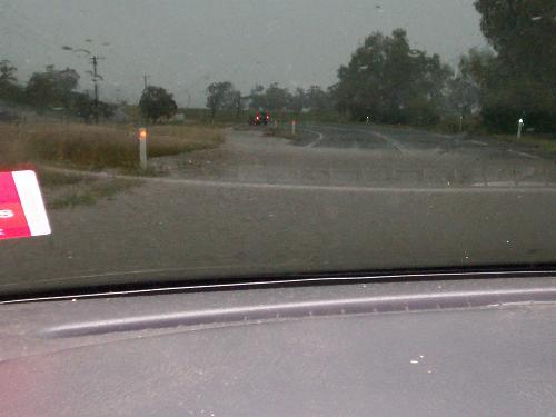 floods - driving through the water over road