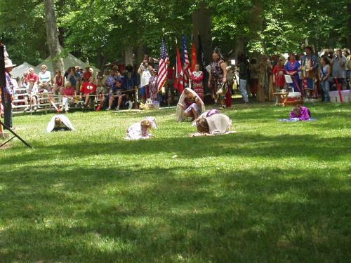 Butterfly Dance - Here little girls dance as butterflies that begin in a cocoon and as the dance progresses they come out of their cocoons and flit around the circle.