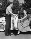 Gentleman - Man open door for woman.