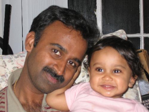 Daddy's pet - This photo was taken very recently. Tanmay's teeth are showing and this is one of Gopi's(my husband) favorites.