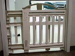 Baby Gate - A top pressure baby gate that can be used on steps or in doorways to block children or pets from entering or exiting.