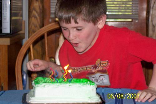 7th Birthday, Blowing Out Candles - 7th Birthday, blowing out Candles. He was so excited and happy. From 1-3, he hated us holding him by his cake when guests sang. Now, he LOVES it. I thank God!!