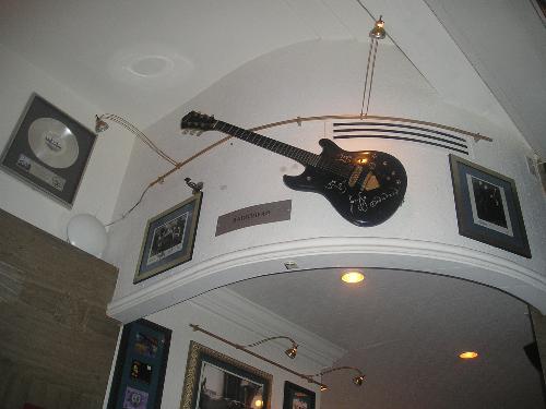 Hardrock cafe - When I took my vacation to hardrock cafe, and stumbled opon this giant guitar. Then I noticed there was a million like. Like a bazziolion Rock stars appparently sign their name on a oversized version of their guitar.
This particular one is just the dirst one I saw so I decided to take a picture. There was a actually some rockband there when I went, but I have no clue what their name is. Hardrock cafe - When I took my vacation to hardrock cafe, and stumbled opon this giant guitar. Then I noticed there was a million like. Like a bazziolion Rock stars appparently sign their name on a oversized version of their guitar.
This particular one is just the dirst one I saw so I decided to take a picture. There was a actually some rockband there when I went, but I have no clue what their name is.