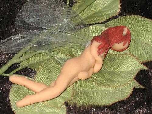 My Art - This is one of the faeries that I sculpt. She is about 4 1/2 to 5' long, made of polymer clay. Although I have a registered copy right, I really haven't tried to 'go public' with them. I guess I'm what they call an outsider artist, but I really don't know where to begin.