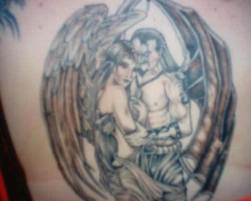 My Back piece - I got this in 2006 along with 3 others on my back for me it means forbiden something i cant seem to get, someone i see in my dreams and the pain i feel inside of not being with someone.