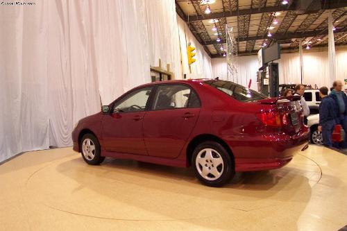 Corolla 2002 at Richmond Car Show - Safety is always an issue in smaller cars, and Toyota hasn't ignored it. In addition to the features you'd expect, the Corolla has three-point safety belts in all positions as well as optional side-impact air bags, rare in this price class. Other features of note include hood hold-down hooks, daytime running lights, front seat belt force pretensioners, and seat belt height adjusters. This will help you survive an accident. A temporary spare tire is standard. Fuel economy is this car's forte. The test vehicle yielded 26 mpg in a mix of city and highway driving.