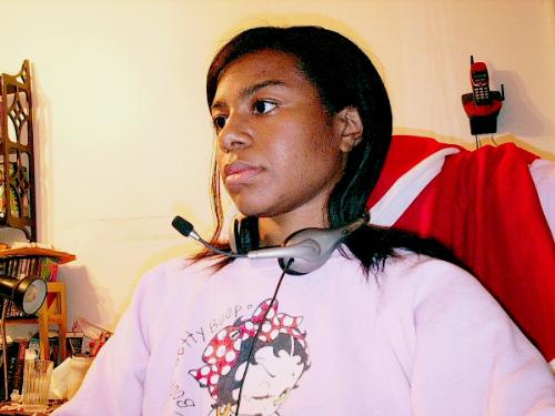 Me - I took a picture of myself with my crappy camera. Quite a bit of color and brightness retouching had to be done with this photo.  This is me playing world of warcraft while talking to my guild members on Ventrilo.