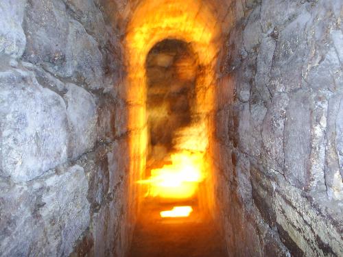 Tunnels beneath Wailing Wall in Israel - If you ever go to Israel this is one area not to be missed! There are beautiful tunnels that run underneath the Wailing Wall in Jerusalem. Between the damp air, the huge rock walls and the light shining around the corners, the feeling in this area is like no other. It is common to see people praying along the walls.
