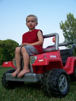 Cade - A quick pose on one of his favorite outdoor toys.