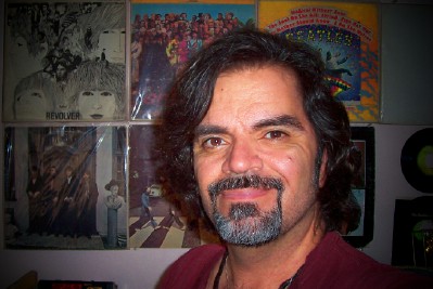 Frankie In The Merry Old Month Of May, 2007 - What can I say? This is the most recent photo of myself. Those are actual Beatles albums from the 1960s hanging on the wall behind me.