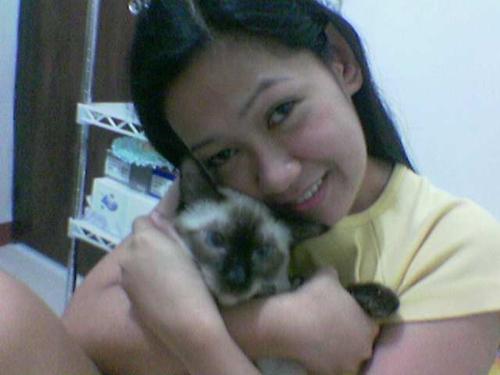 My Cat and I - She's my baby. She's one of my great sources of joy. She lights up life, well aside from husband. She accepts me for who I am and gives me unconditional love. She is no other than my cat - Chippy.