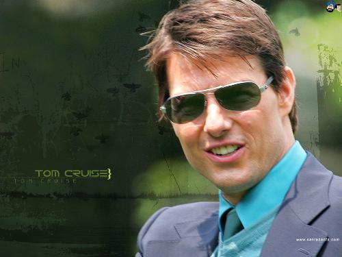 Tom Cruise - Tom Cruise looking very handsome in a grey coat with blue shirt.He is also wearing googles which is making him look even more better.