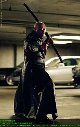 Morpheus in The Matrix Reloaded - Morpheus holding a Samurai in the Garage in the movie The Matrix Reloaded
