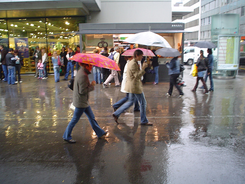 Do you enjoy walking in the RAIN? - A picture of people walking in the rain with umbrellas. Taken with permission from http://farm1.static.flickr.com/202/485047948_62fedf373f.jpg?v=0 .
