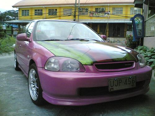 Honda LXi 96 model - im selling a Honda LXi 96 model, fully modified, brand new seat cover (top of the line), Brand new MP3 player, pink exterior and interior designs, pink park light and brand new mag and wheel. ONLY 260K! if interested call me at 09162385829, for people around metro manila and southern Tagalog region only.