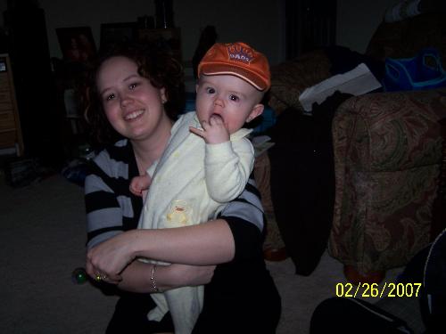 zach and mommy - zach fighting to get away and take his hat off.