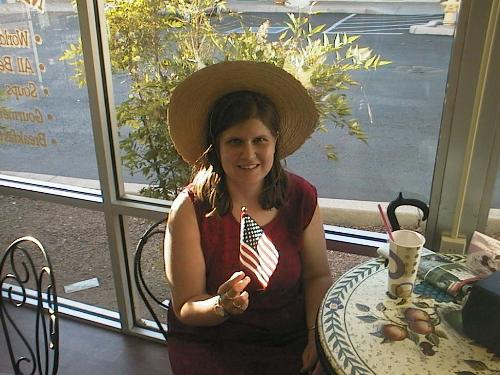 Me And My Flag - Here I am at I-Scream Cafe in Sedona Arizona, holding the little American flag they gave me. I love flags of all nations. I was happy to receive this one. I'm going to include it in a bouquet along with Danish, Canadian and Russian flags.