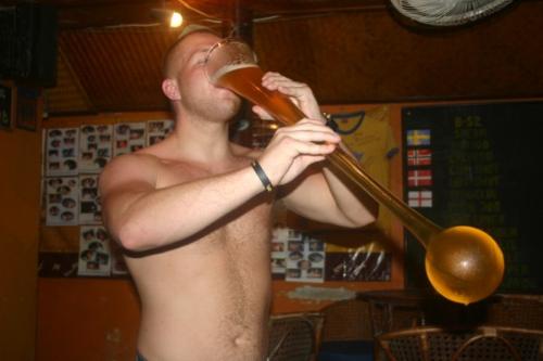 Adam of UK - Viking Bar's 1st Official Winner in t - Viking Bar in Koh Samui, Thailand has two drinks competition. One is the shot competition and the other is the Yard of Ale competition. The Yard of Ale competition was introduced in the bar only in August 2006. A few people have tried it but none has won. Some have just drunk from it as part of novelty.  But on 19th June, Adam gave it a shot and actually completed the whole yard within 30 seconds. So, he became the 1st official winner of the Yard of Ale competition. For winning, he got a free Viking Bar T-shirt.