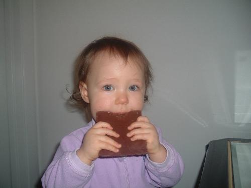 Busted! - This is a picture of my daughter busted eating a huge Hershey's bar. The look on her face was priceless when I busted her.