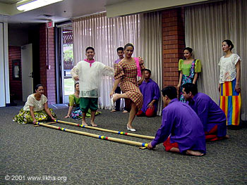 Tinikling Dance - The picture above was taken at the performance at the Sunnyvale Library in California for the Cinco De Mayo celebration of the arts 2001. Photos by Divine Marcelo
