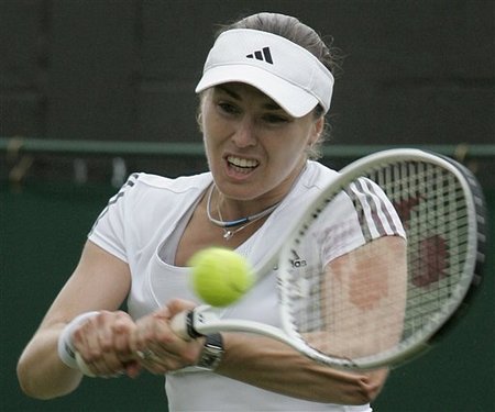 Martina Hingis, 1st Round, Wimbledon 2007 - Action shot of Hingis in the first round at Wimbledon 2007. Martina Hingis, 1st Round, Wimbledon 2007 - Action shot of Hingis in the first round at Wimbledon 2007.