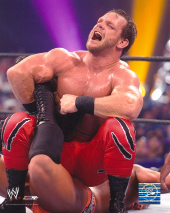 Chris Benoit - Chris Benoit applying the sharpshooter.