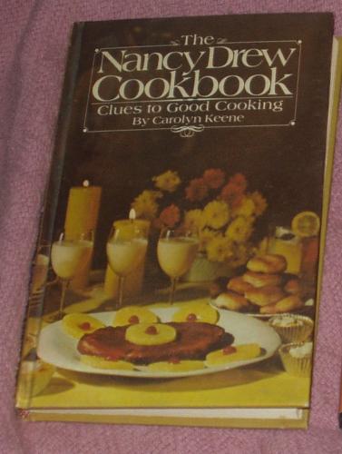 Nancy Drew Cookbook - by Carolyn Keene. It's based on the character from the popular girls mystery series about Nancy Drew. The recipes have names from the book series and/or characters. It's fun and one of my favorites.