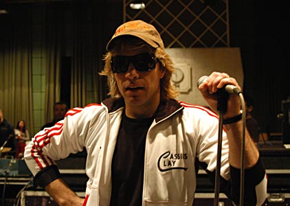 Jon Bon Jovi - Jon Bon Jovi, he appears to be in a recording studio.
