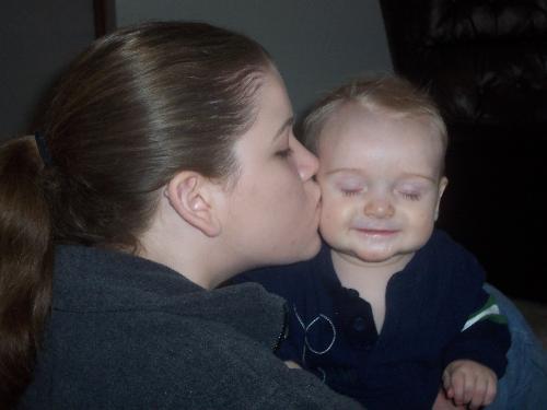 my son - Bobo enjoying a sammy kiss. This is my son and my sister.