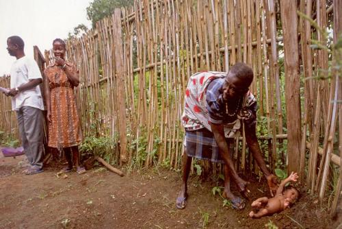 tradition - Its tradition. People believe that child is a gift of nature. So in some parts of World when new child is borned people take him and let him sleep on land. Just because belief that its natural gift and will be with nature for always
