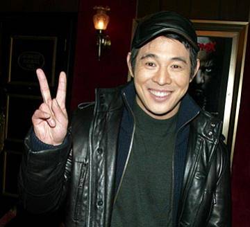 jet li - jet li giving a peace sign.