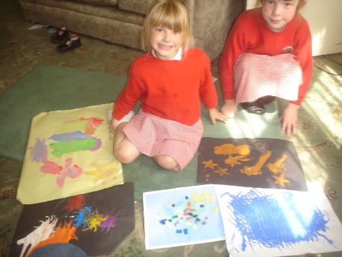 this is jenni with her sister and the art - lol Jenni, my youngest daughter was very proud of her art portfolio and wanted me to put it on display