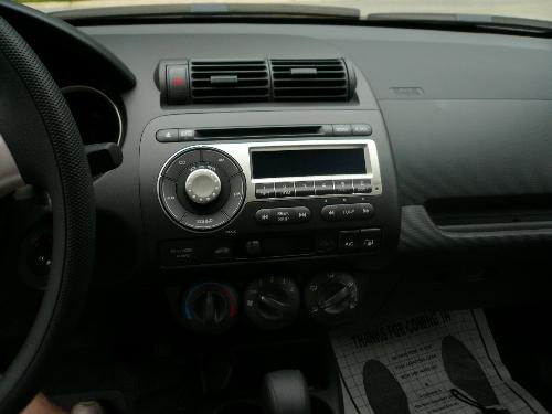 Honda Fit - The stereo system in my new car. It has a nice radio and cd system with cool features and great sound.