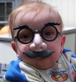 My funny son - This was taken at my son's first birthday party. He had so much fun with these glasses, and so did we!