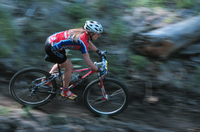 Mountain Bike - A girl running with her mountain bike.