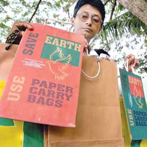 use paper bags - Activists of Environ, a conservation group campaigning for use of paper bags in place of plastic bags.